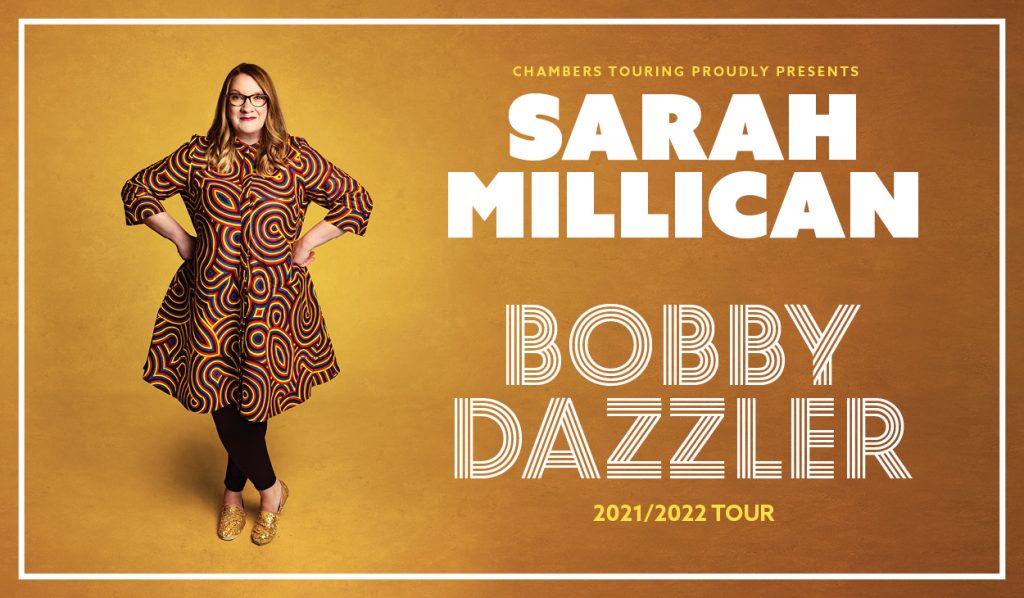 Sarah millican stood in front of a yellow background