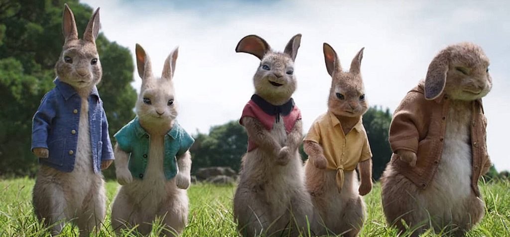 peter rabbit and his rabbit friends stood together