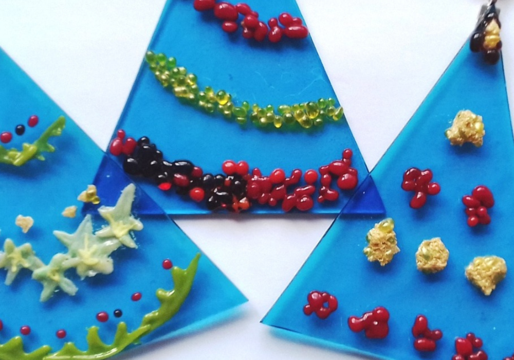 Blue glass christmas trees, decorated with multicolour fused glass.
