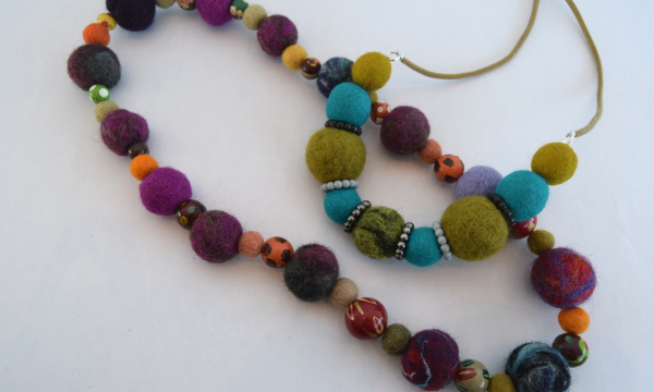 Two necklaces made from needle felted beads.