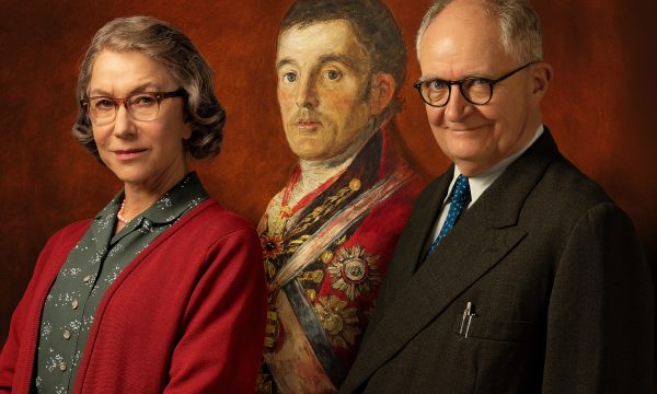 Helen Mirren and Jim Broadbent sit with a painting of The Duke in the background.