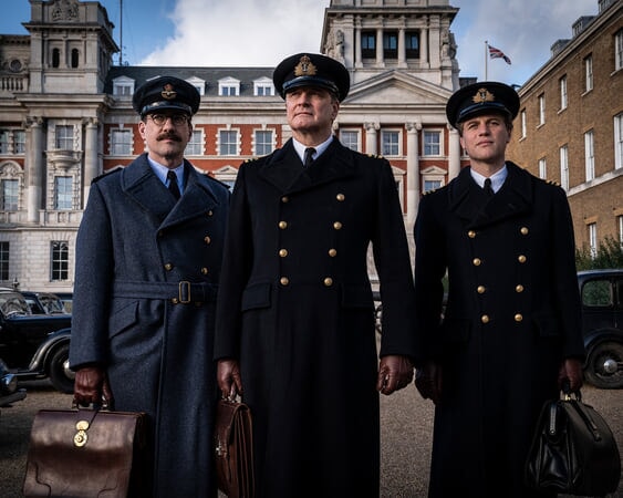 Three male characters from Operation Mincemeat standing outdoors in military uniform