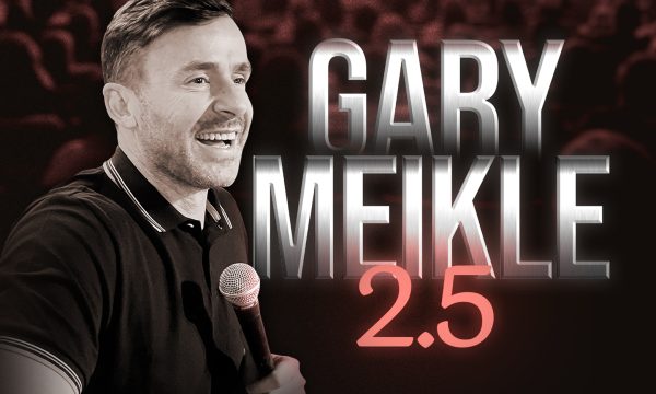 Comedian Gary Meikle holding a microphone and laughing, beside him are the words Gary Meikle 2.5