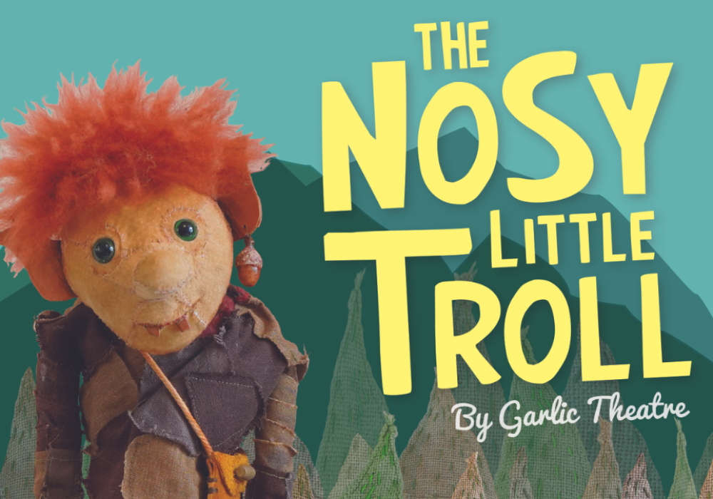 Image of The Nosy Little Troll puppet with trees and mountains in the background. Text: The Nosy Little Troll By Garlic Theatre