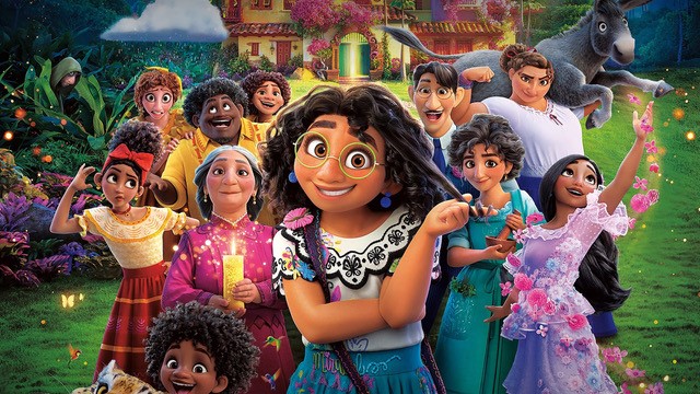 Animated image of a Columbian family from many generations. At the front stand Mirabel, a young woman with dark curly hair, and round glasses.