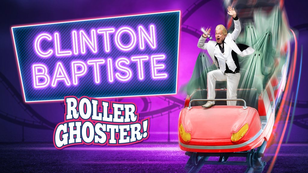 Comedian Clinton Baptiste stands atop a red roller coaster car, full of cloaked ghosts. He is holding a mic with one hand, and has his other hand high in the air. One of his legs is up on the front of the car.