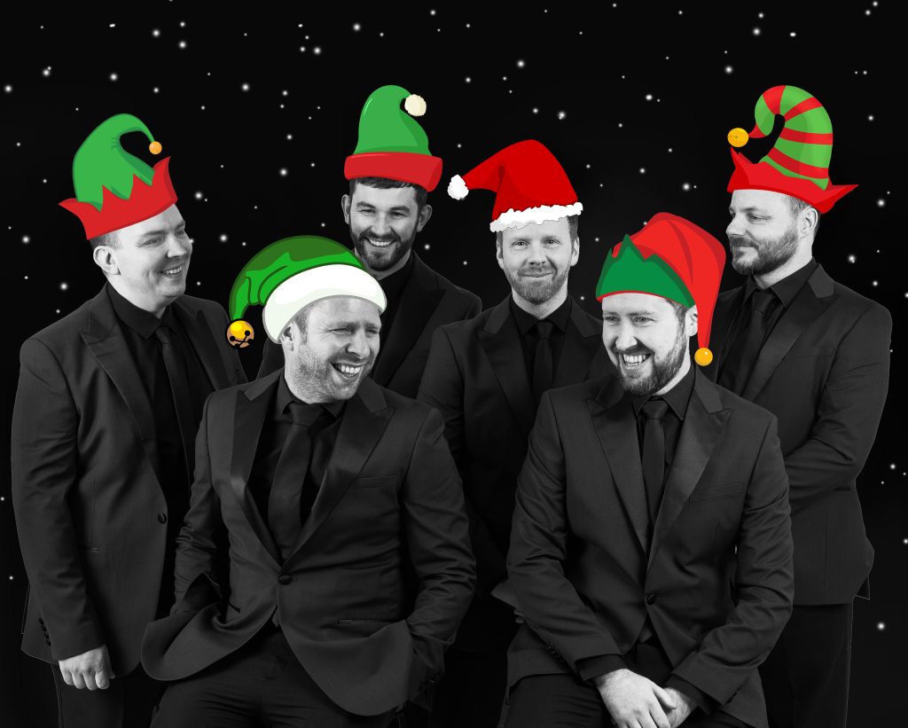 The Funk Collective band all together with Christmas items on their faces and heads