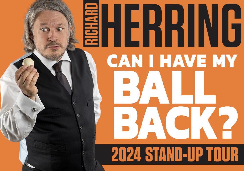 Richard Herring, a man with collar length grey hair, wearing a white shirt, and dark waistcoat and tie, is holding up a small ball and looking dubiously at it. Text: Avalon Presents Richard Herring Can I Have My Ball Back? 2024 Stand-Up Tour