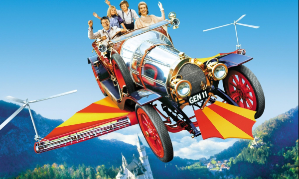 The four main characters, Mr Potts, his two children, Jeremy & Jemima & along with Miss Truly Scrumptious gleefully wave in the flying car, Chitty