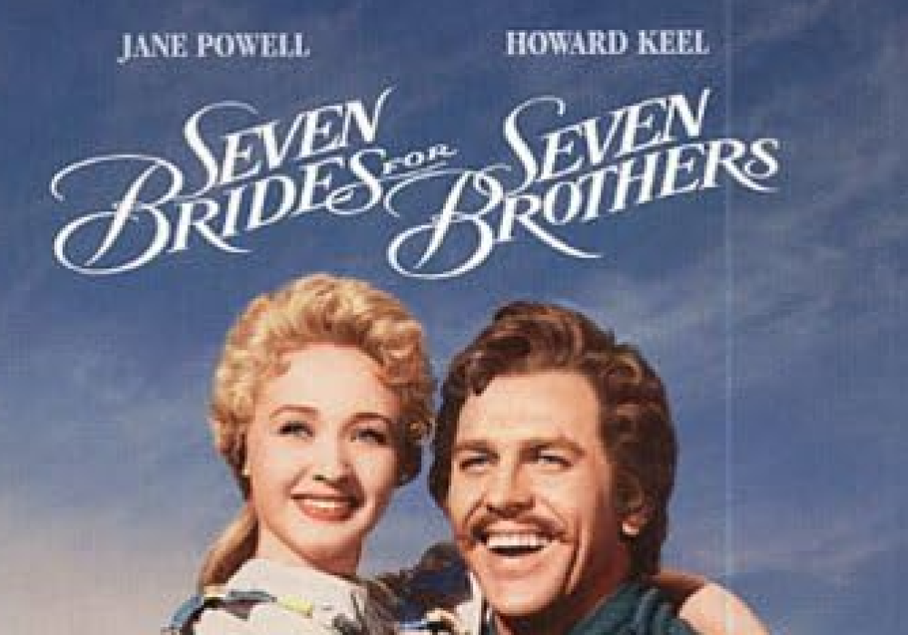 Two of the main characters, played by Jane Powell & Howard Keel embrace and look on happily