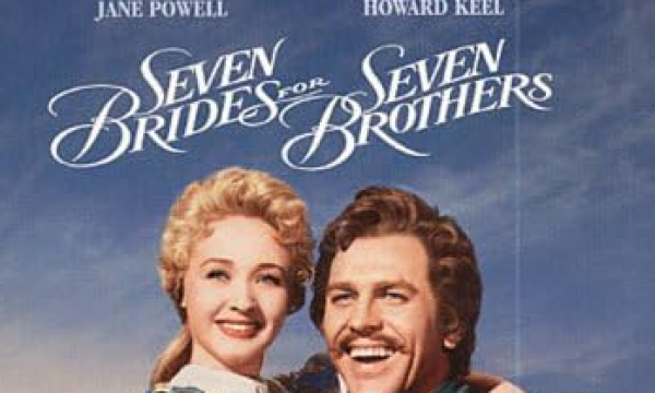 Two of the main characters, played by Jane Powell & Howard Keel embrace and look on happily