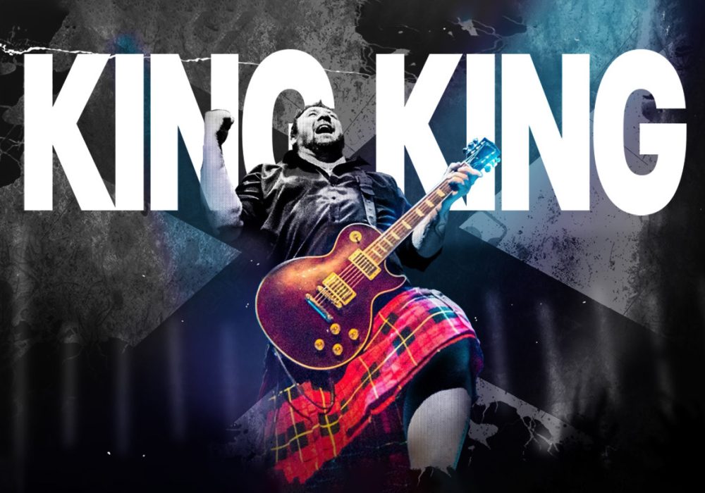 King King guitarist in front of the words King King