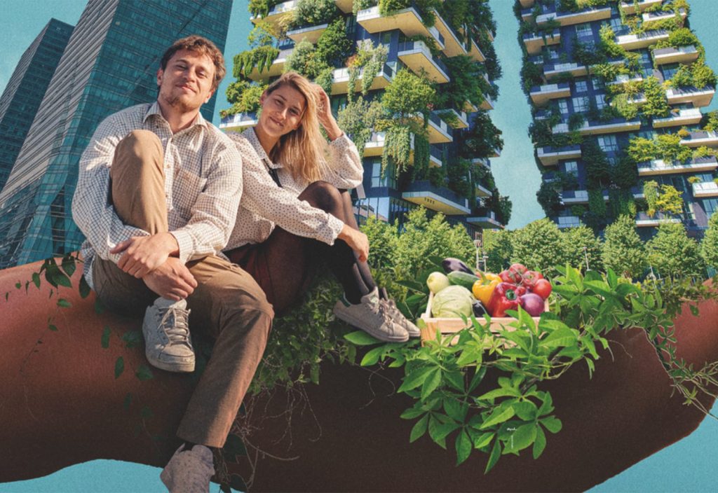 A white male with short fair hair wearing a white shirt and brown trousers sat on a wall with one knee up. Next to him is a white female with long blonde hair dressed the same with her knees up. The background shows high-rise buildings depicted with flowers.