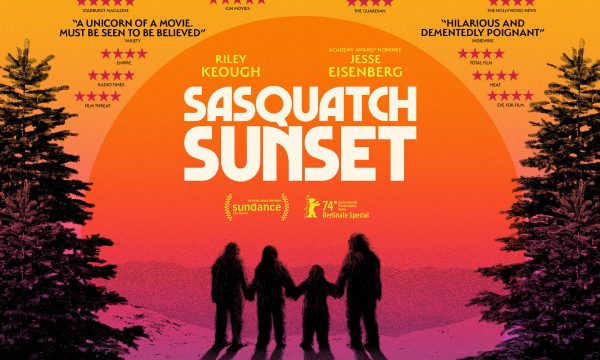 At either side of the image is half of a fern tree in black. There is a sunset with yellow, orange, pink with Sasquatch Sunset in white text and the image of 4 individuals in black.