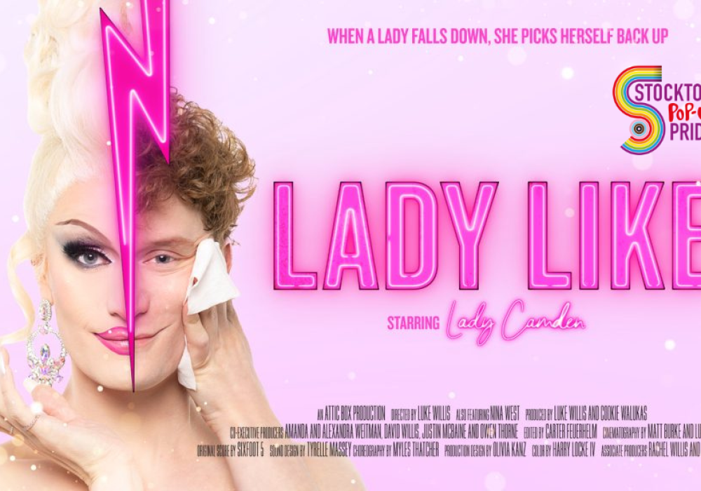 Pink background and Lady Like in pink text. A image of Lady Camden a drag queen, right half of a face natural a male with ginger curly hair separated by a lightning bolt and the left side is in drag make up, with white blonde hair. Image also shows the Stockton Pop-Up Pride logo.